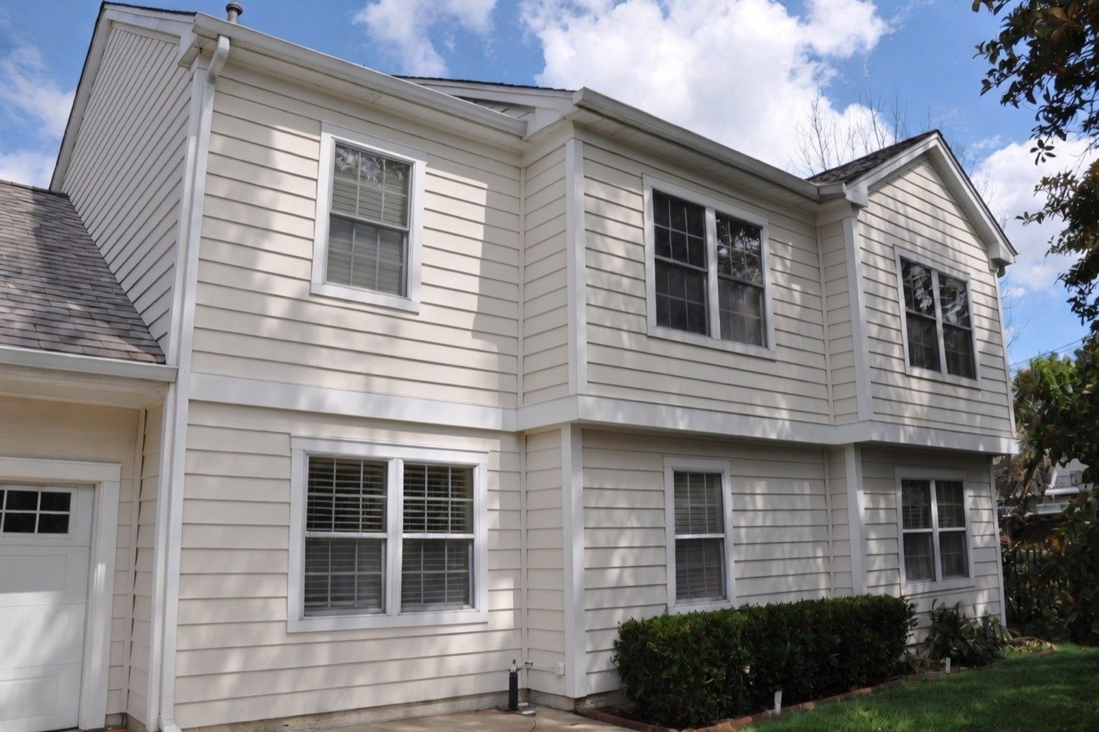 Completed soft washing — siding restored to its original color, streaking removed